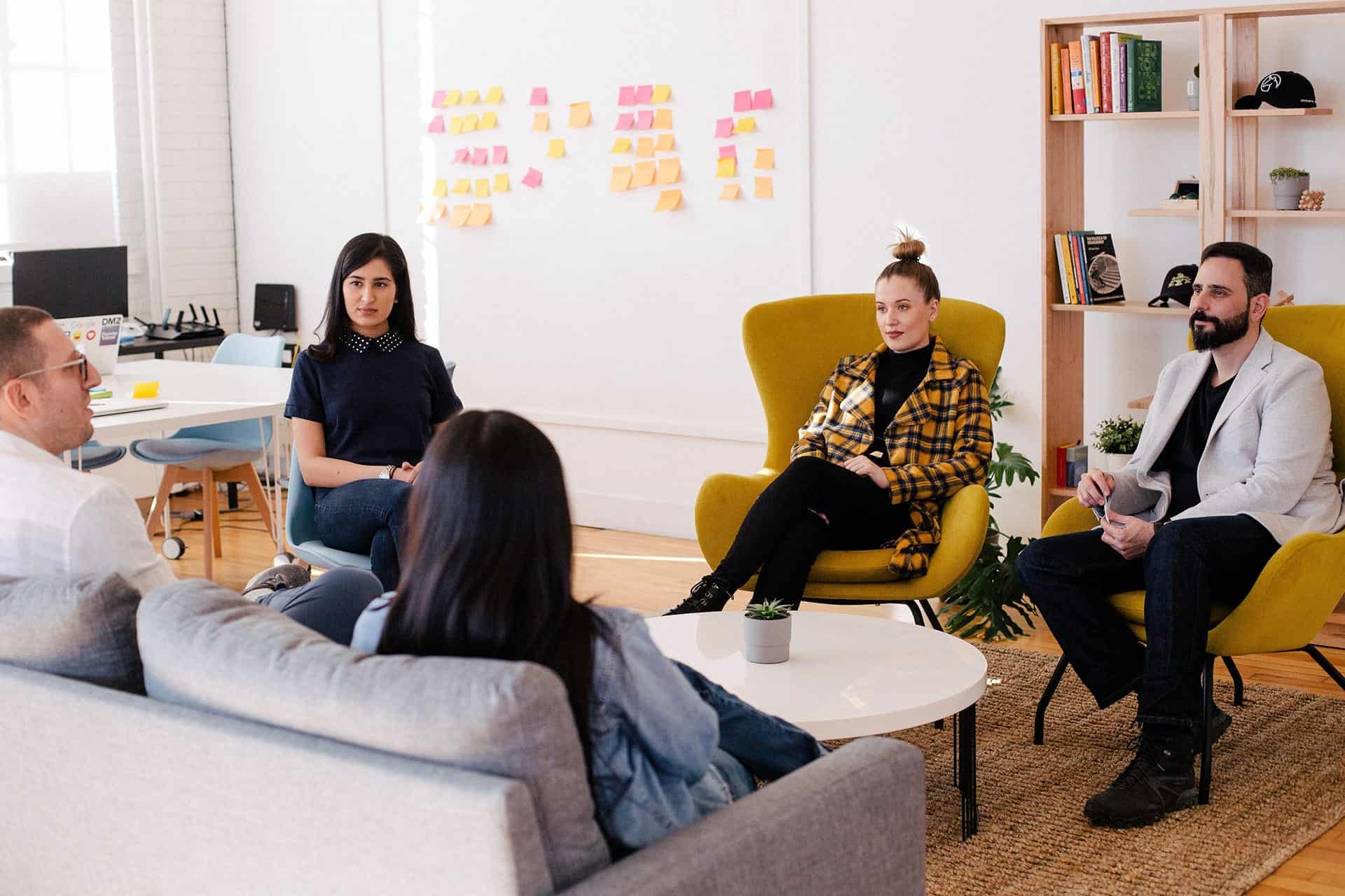 Team reviewing progress and performance goals in a boardroom